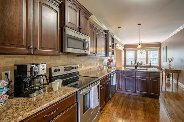 kitchen with crown molding, appliances with stainless steel finishes, dark hardwood / wood-style flooring, and sink