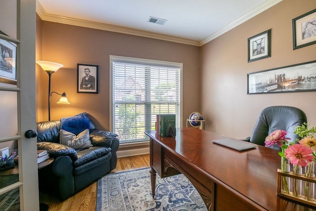 office area with ornamental molding and hardwood / wood-style floors