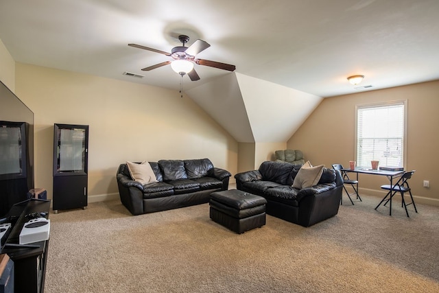 carpeted living room featuring ceiling fan and vaulted ceiling