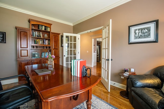 office with crown molding, light hardwood / wood-style flooring, and french doors