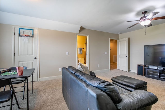 living room featuring light colored carpet and ceiling fan