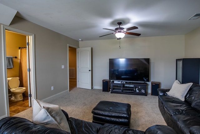 living room featuring ceiling fan and carpet flooring