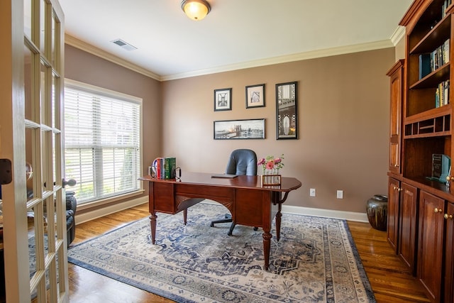 office featuring crown molding, french doors, and hardwood / wood-style floors