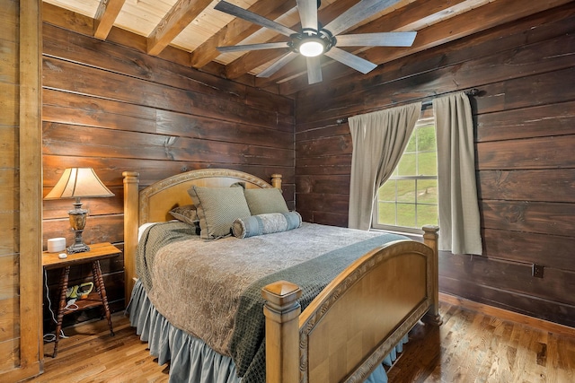 4818 Ensor Hollow Rd, Buffalo Valley, TN 38548 - bedroom with beamed ceiling, wood finished floors, wood walls, and wooden ceiling