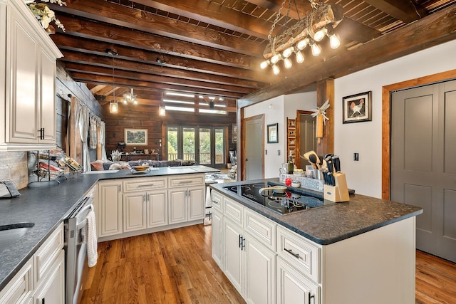 4818 Ensor Hollow Rd, Buffalo Valley, TN 38548 - kitchen with black electric cooktop, stainless steel dishwasher, beamed ceiling, light wood-style floors, and a peninsula
