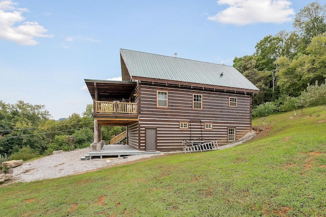 4818 Ensor Hollow Rd, Buffalo Valley, TN 38548 - view of home's exterior featuring a wooden deck, a yard, stairs, and metal roof