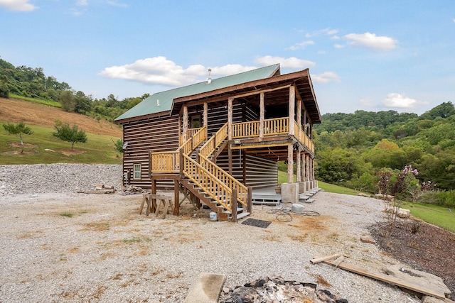 4818 Ensor Hollow Rd, Buffalo Valley, TN 38548 - back of house featuring stairs, a deck, a wooded view, and metal roof