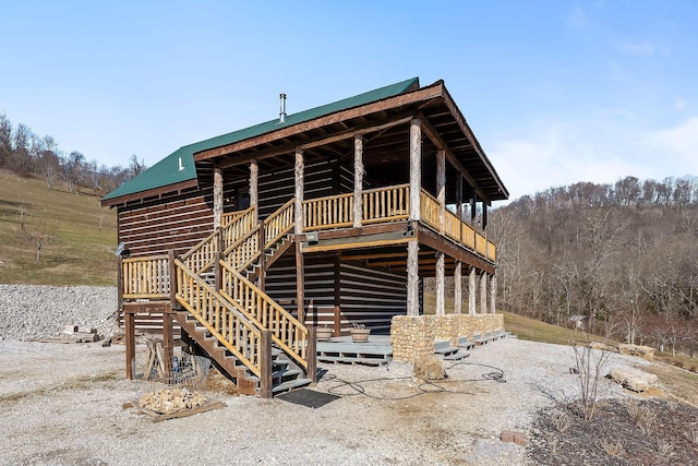 4818 Ensor Hollow Rd, Buffalo Valley, TN 38548 - rear view of property featuring stairway, a deck, and metal roof
