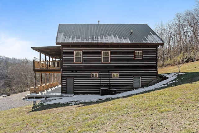 4818 Ensor Hollow Rd, Buffalo Valley, TN 38548 - view of home's exterior with a wooden deck, a yard, central air condition unit, and metal roof