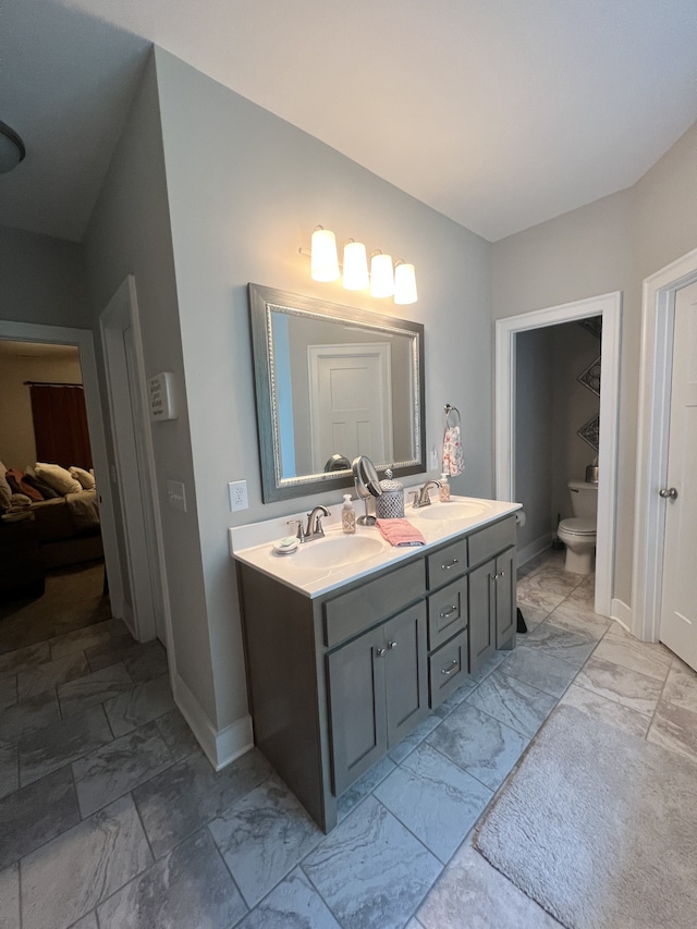 bathroom with vanity and toilet