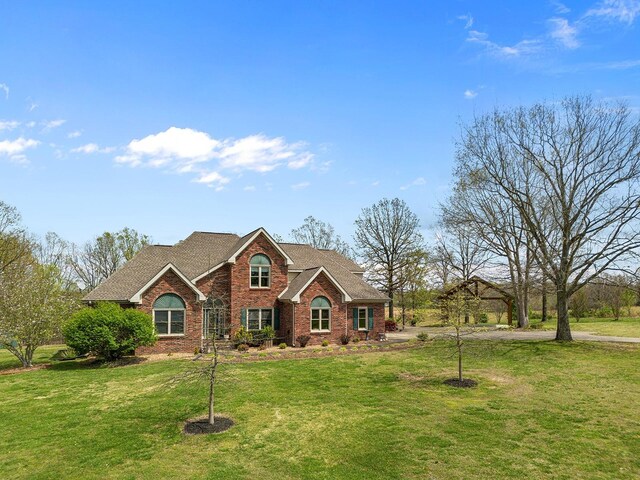 view of front of home with a front lawn