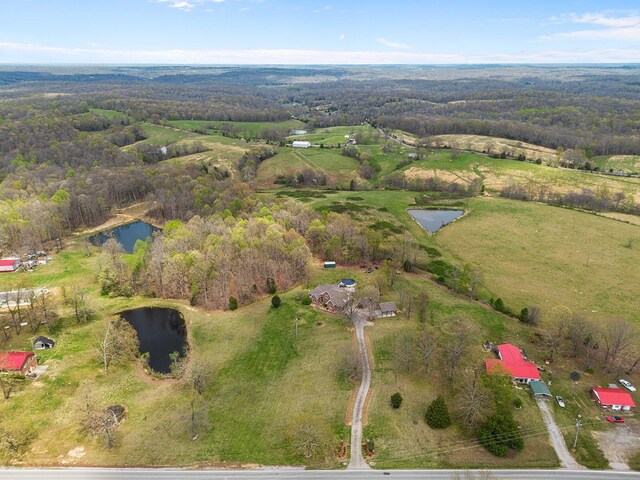 aerial view with a water view and a rural view