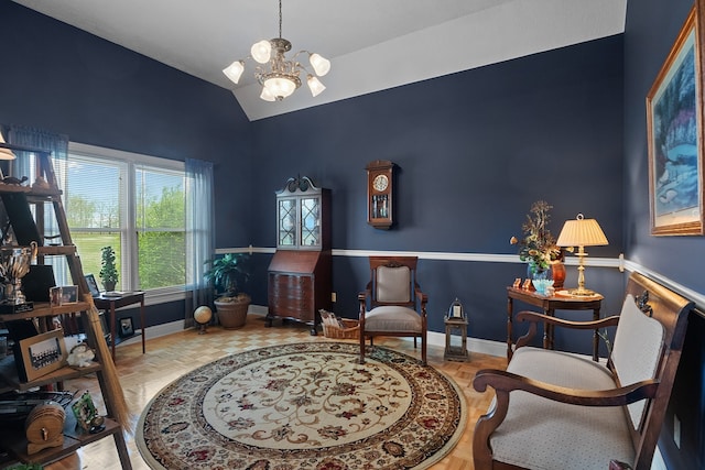 living area featuring vaulted ceiling and a chandelier