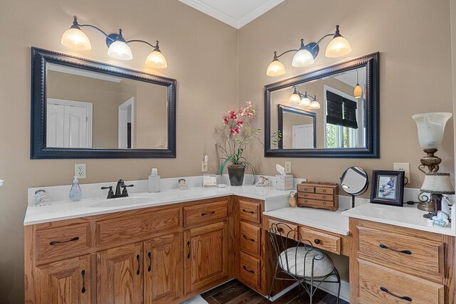 bathroom with wood-type flooring, vanity, and ornamental molding