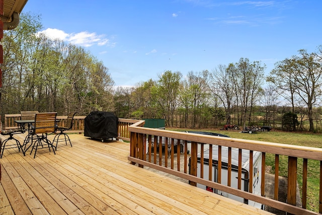 wooden terrace with area for grilling