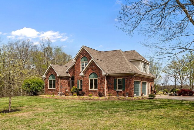 view of property featuring a front lawn