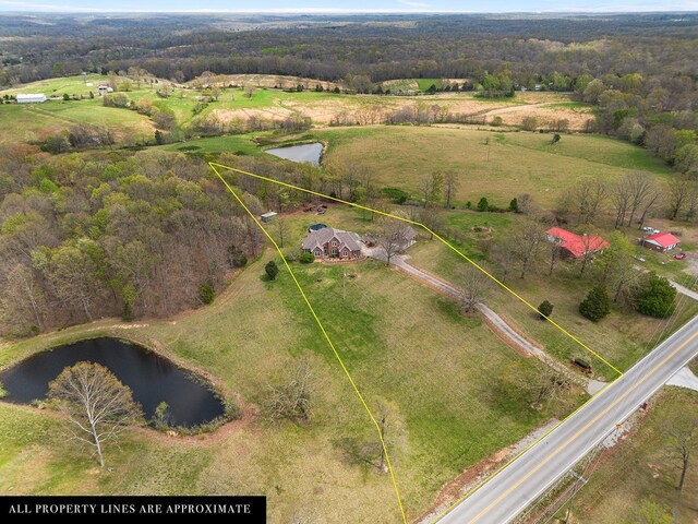 bird's eye view featuring a water view and a rural view