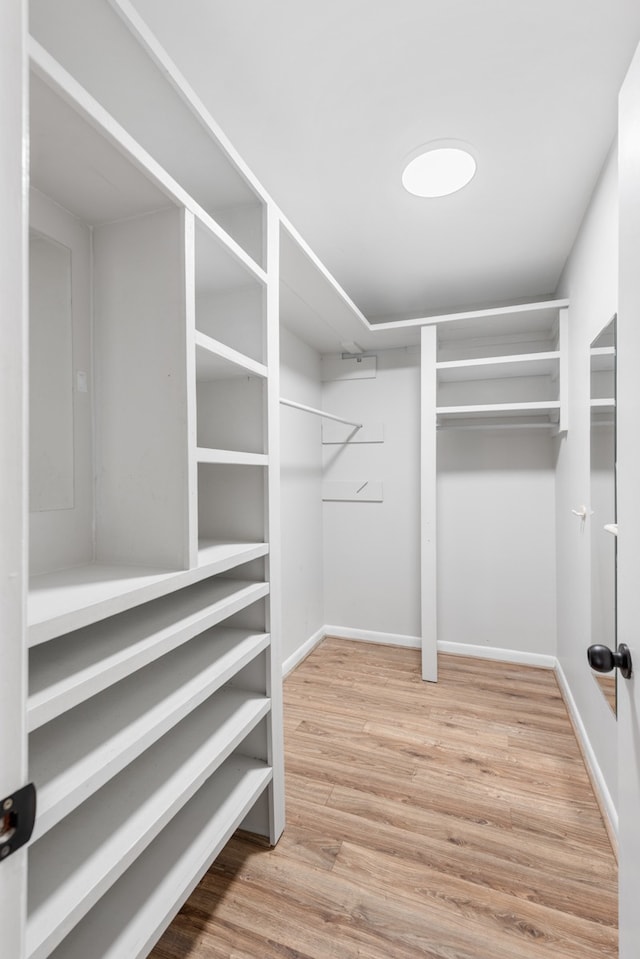 walk in closet featuring light hardwood / wood-style floors