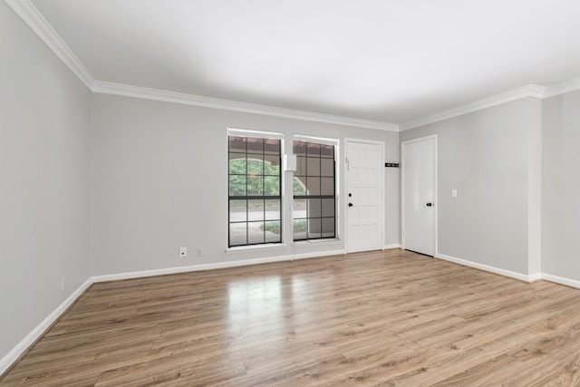 unfurnished room featuring crown molding and light hardwood / wood-style flooring