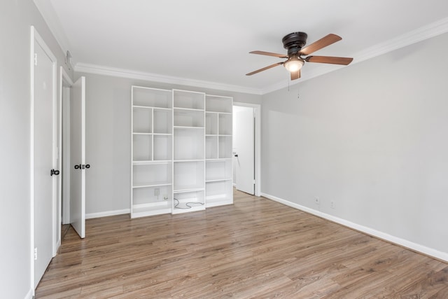 unfurnished bedroom with crown molding, ceiling fan, and light wood-type flooring