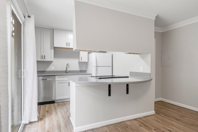 kitchen with white cabinets, white fridge, light hardwood / wood-style floors, and stainless steel dishwasher