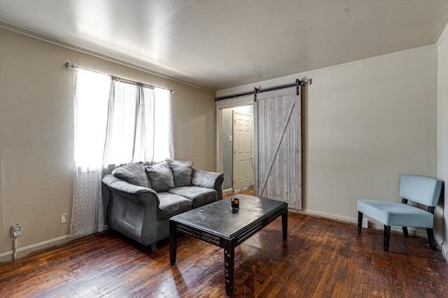 living room featuring ornamental molding, a barn door, and dark hardwood / wood-style floors