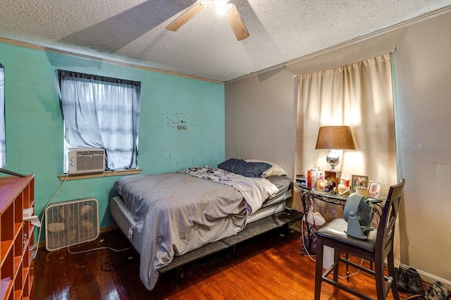 bedroom featuring cooling unit, ceiling fan, and dark hardwood / wood-style flooring