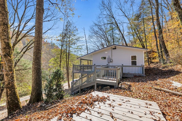 back of house featuring a deck