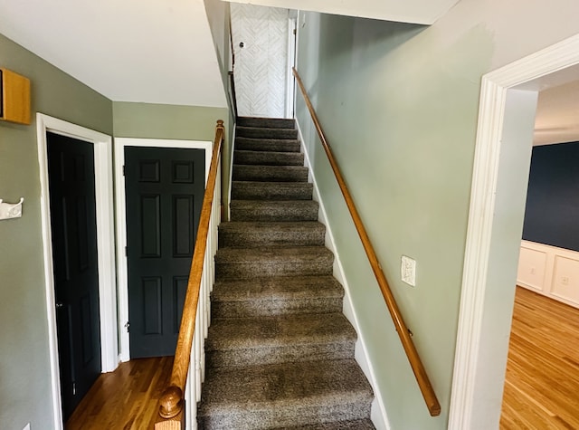 staircase featuring hardwood / wood-style flooring