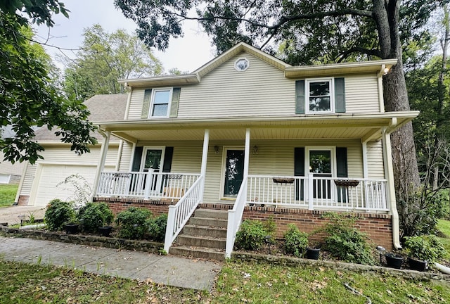 view of front of house featuring a garage and a porch