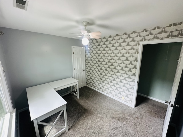 interior space with ceiling fan and carpet floors