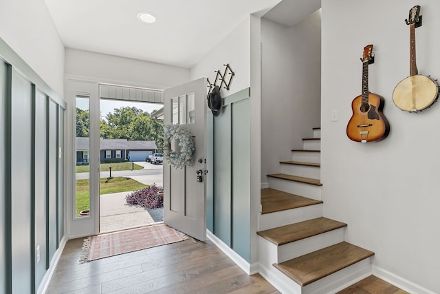 entrance foyer featuring a wealth of natural light and wood-type flooring