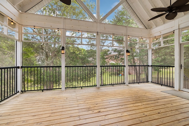 unfurnished sunroom featuring ceiling fan and lofted ceiling