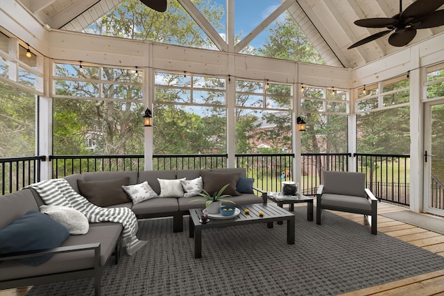 sunroom / solarium featuring ceiling fan and lofted ceiling