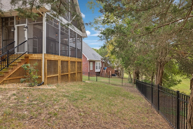 view of yard with a sunroom