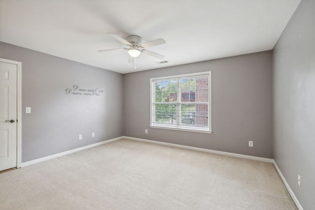 carpeted empty room with ceiling fan