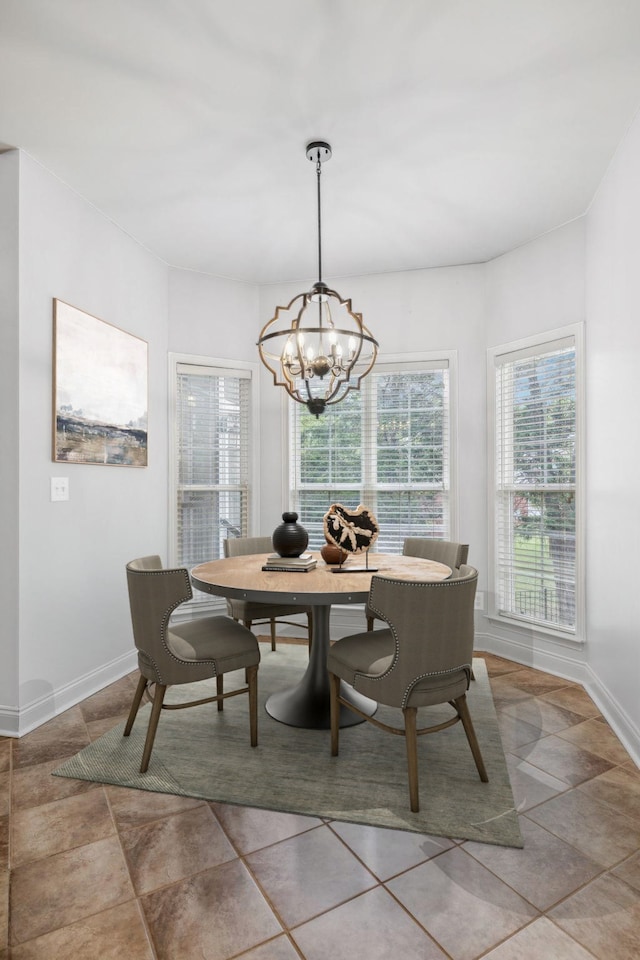 dining space with an inviting chandelier