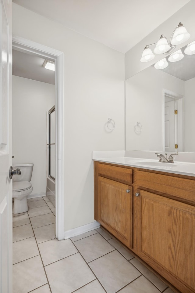 full bathroom featuring shower / bath combination with glass door, tile patterned flooring, vanity, and toilet