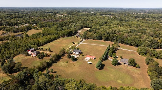 drone / aerial view with a rural view and a forest view