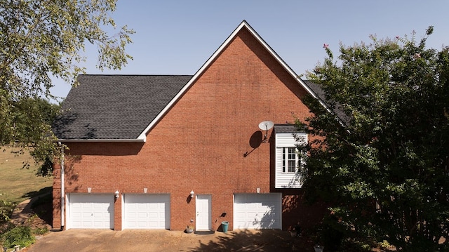 view of side of home with a garage