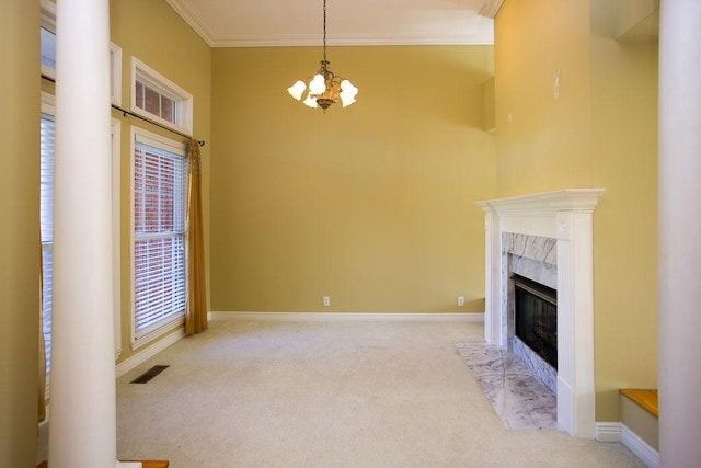 unfurnished living room featuring crown molding, a chandelier, a fireplace, visible vents, and carpet