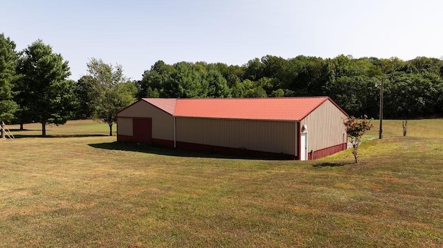 view of pole building with a yard