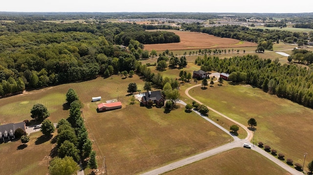 birds eye view of property with a rural view