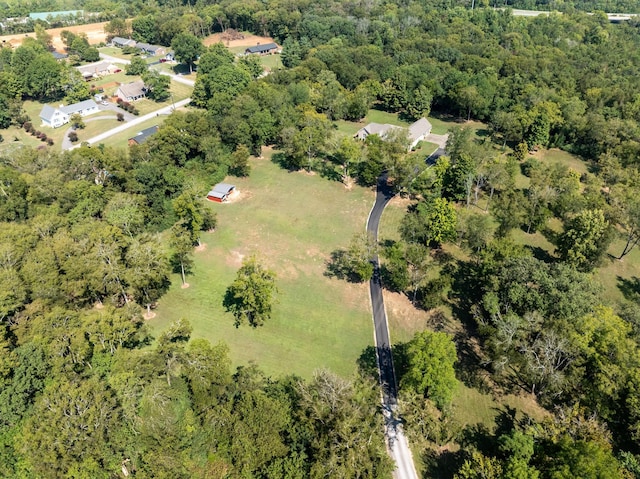 bird's eye view featuring a forest view