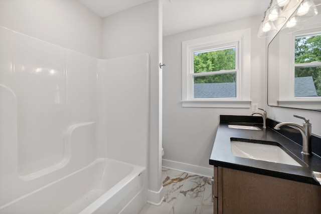 bathroom with vanity, toilet, and plenty of natural light