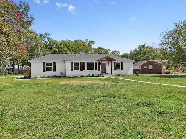 single story home featuring a front yard