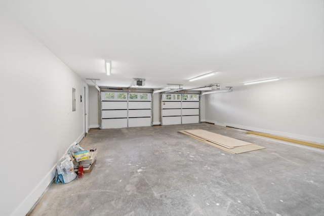 garage featuring a garage door opener and electric panel