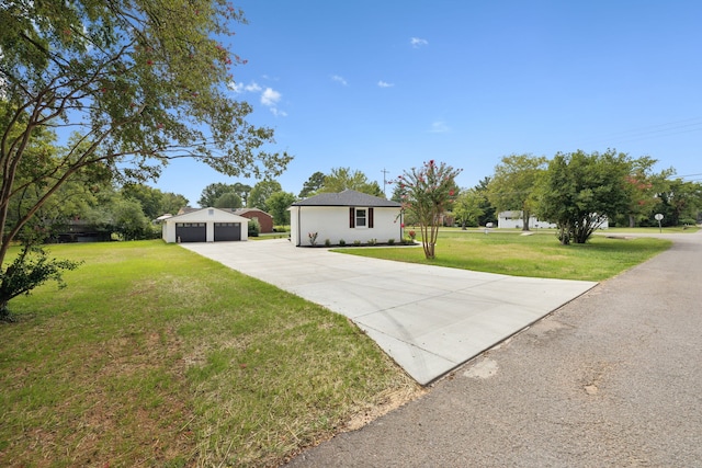 single story home with a garage and a front yard