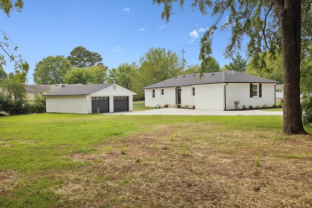 back of house with a lawn