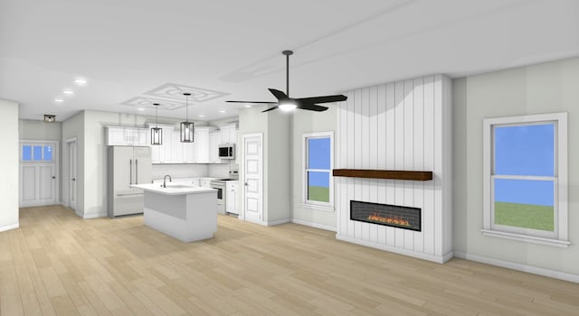 kitchen featuring white cabinets, a fireplace, light wood-type flooring, white appliances, and ceiling fan